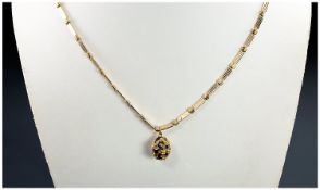 High Carat Gold Overlaid Egg Pendant with gold marks to link, supported in a gold plated long