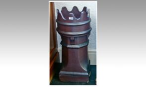 Late Victorian Tall Chimney Pot, in red clay, glazed, with a castellated top, moulded body, canted