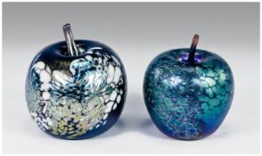 Two Various Okra Apple Paperweights, both with iridescent blue/green finish, the larger having
