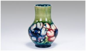 Macintyre Signed Vase `Anemone` design. Green and blue ground. 5 inches tall.