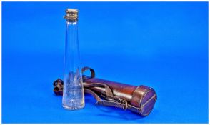 A Tapered Glass Hunting Flask Silver Plated Mounts, Complete With Leather Holder.