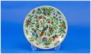 Small Chinese Celadon Plate, hand enamelled with a variety of randomly placed polychrome flowers,