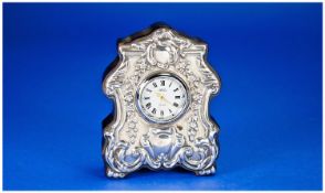 J Carr Miniature Silver Covered Mantle Clock, with white dial and black Roman numerals, the front