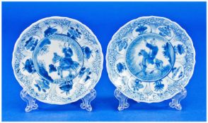 A Matched Pair of Kang Shi Period Saucer Dishes, with lotus shaped edges, the central panels