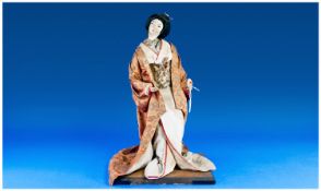 Japanese Fabric Collectable Doll, dressed in a white crepe kimono with brocade obi, a further