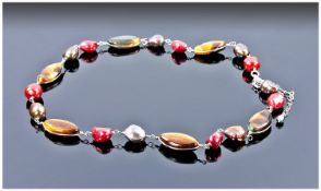 Baroque Freshwater Pearl and Two-Tone Tiger Eye Necklace, the pearls in cherry red and peacock