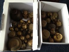 Two Boxes Containing a Collection of Oriental Brass Bells.