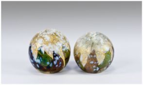 Two Similar Isle of Wight Paperweights of globe shape, each with a pattern of green and brown leaf
