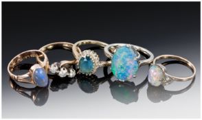 Collection Of Four 9ct Gold Rings, Comprising Two Opal Set, Three Stone Diamond Ring And A Gem Set