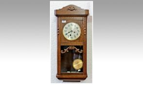 Early 20th Century Gustaf Becker Oak Wall Box Clock, silvered dial with Arabic numerals.