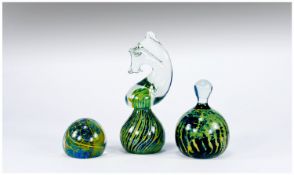Three Mdina Paperweights comprising clear glass horse`s head mounted on a dome of typical Mdina