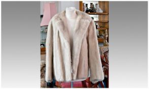 Platinum Mink Ladies Short Jacket, with double kick pleat to back.