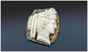 Early Roman White Paste Glass Cameo of a noble roman woman or dinah, with ribboned hair intertwined