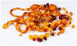 Bag of Loose Amber Beads and a Long Amber Necklace, early to mid 20th century, total weight 113
