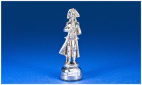 A Realistic Silver Model Of Admiral Lord Nelson in a traditional pose on an integral plinth.