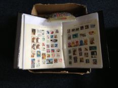 Box Containing Stamp Album, first day cover album & large bag of loose stamps.