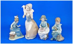 Four Nao by Lladro Figures comprising girl with puppy, boy with rabbit, girl with lamb and girl