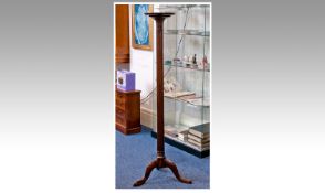 Late Victorian Mahogany Torchere, the moulded circular top raised on turned and fluted column with