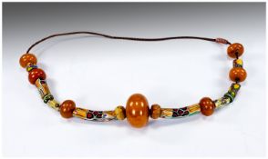 Large Amber Bead and African Trade Bead Necklace, comprising a central butterscotch amber rondelle,