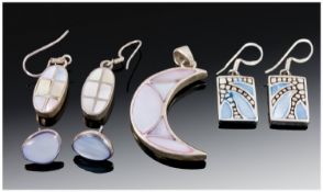 Three Pairs Of Silver Earrings And A Silver Pendant.