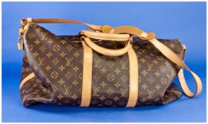 Louis Vuitton Travel Holdall, classic brown LV monogram canvas bag with buff leather handles,