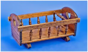 Miniature Wooden Cot, 20th century, with heart shaped pierced curved ends, with spindle galleried