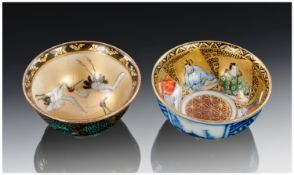 A Pair Of Fine Quality Japanese Porcelain Decorated Saki Cups, one depicting white cranes in