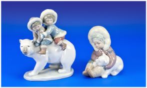 Two Lladro Figures 1. Eskimo Boy cuddling Polar Bear, 5 inches in height. 2. Boy and girl riding a