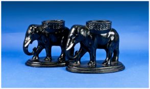 Pair of Black Oriental Elephant Figural Holders, 7 inches high.