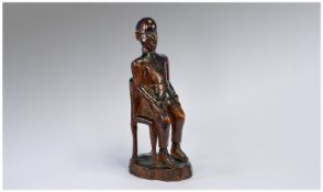 Folk Art. 19th Century Carved Wooden Seated Figure. Possibly North African. 12 inches high.