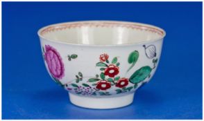Worcester Early Small Footed Tea Bowl - Circa 1765 with garden flower decoration on white ground.