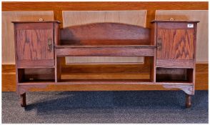 Arts & Crafts Oak Framed Wall Rack, with two cupboard doors to sides, with bookshelf to middle,