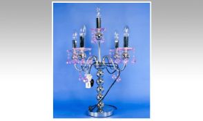 Contemporary Four Branch Table Lamp, with `S` scrolled branches and a central stem, with pink glass