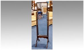 Early 20th Century Mahogany Cheval Mirror, 58 inches high and 14 inches wide.