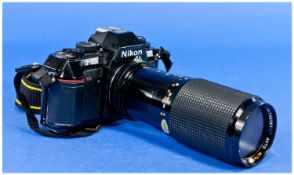 Nikon Camera F3001 with 150mm lens & strap. Good condition.