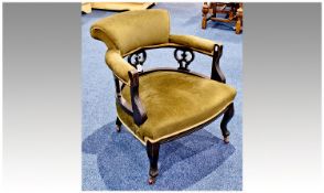 Ebonised Tub Chair padded back cushions,  carved & pierced back splates, raised on table legs,