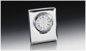 A Silver Bedside Clock With Blue Plush Backing. Quartz movement. Fully hallmarked for Sheffield