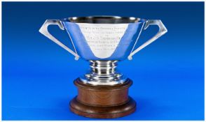 Walker and Hall Silver Two Handled Trophy raised on circular oak plinth with inscription. Hallmark