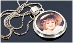 Silver Chain And Pendant Drop. The Pendant Showing An Image Of A Young Girl.