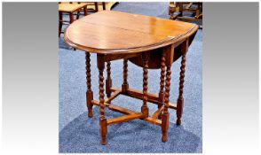 Small Oak Gateleg Table, of two leaf form, raised on Barley twist legs, united by square