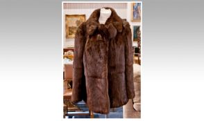 Red-Brown Coney Jacket, self lined collar with revers, slit pockets, clip hook and loop fastening,