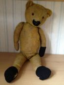 Teddy Bear with `Squeak`, shavings stuffed, well-loved golden plush bear who squeaks when pressed