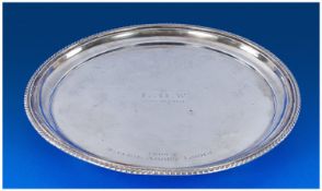 A Silver Circular Salver With Reeded Border, Hallmark Birmingham 1927, supported on 4 ball feet.