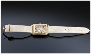 Guess Ladies Watch, fashion watch G75955L supported on a cream leather strap.