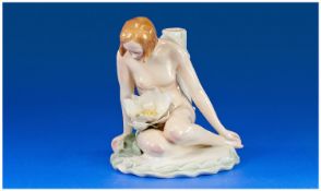 Karl Ens Art Deco Figurine of a naked woman in a sitting position studying a large water lilly. 6.