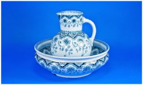 Sarreguemines Jug and Bowl, decorated with medium blue and dark blue symmetrical patterning on a
