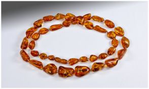 Amber Graduated Nugget Necklace, smoothly polished nuggets of honey colour amber, knotted onto