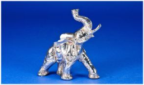 A Realistic Silver Model Of A Trumpeting Elephant. Head & trunk raised and ears flapping. Unmarked