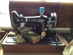 Early 20th Century Singer Sewing Machine, fitted with an oak case and cover, with carrying handle,