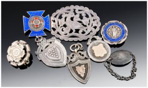 A Collection of Assorted Silver Medals and Brooches. 8 in total, all hallmarked 68.6 grams.